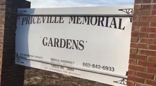 Sign for Priceville Memorial Gardens, featuring contact information for Gerald Adderholt in Tupelo, MS.