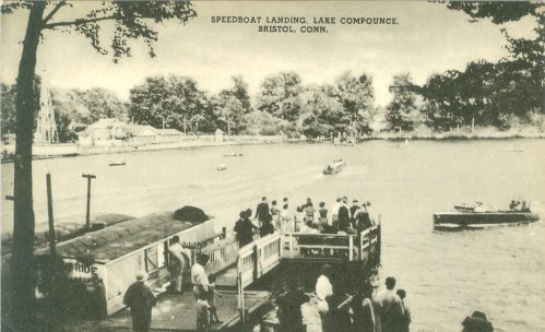Black and white photo of Speedboat Landing at Lake Compounce, Bristol, Connecticut, with people and boats on the water.