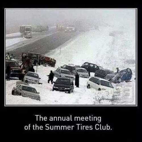 A humorous scene of multiple cars stuck in snow, with a caption about a fictional "Summer Tires Club" meeting.