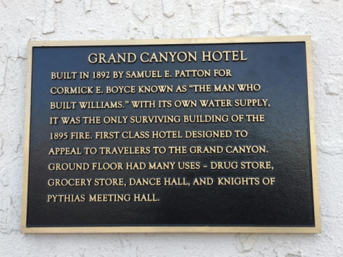 Plaque detailing the history of the Grand Canyon Hotel, built in 1892, highlighting its significance and uses.