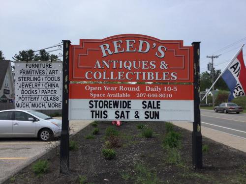 Sign for Reed's Antiques & Collectibles advertising a storewide sale this Saturday and Sunday, open daily 10-5.