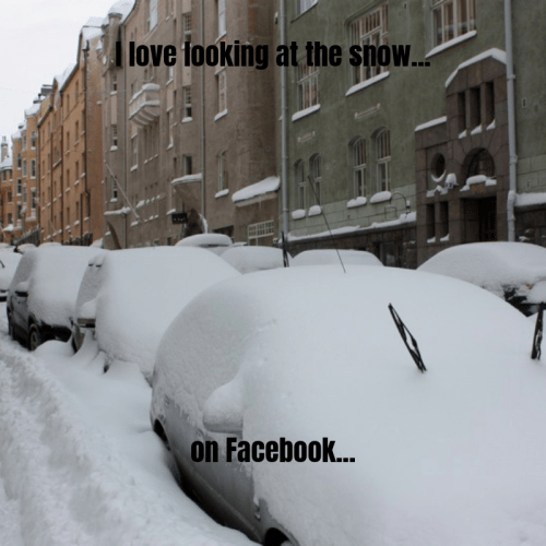 A snowy street with parked cars almost completely covered in snow, featuring text about enjoying the winter scene on Facebook.