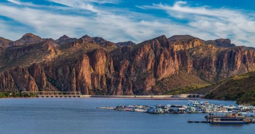 View of Saguaro Lake with the mountains in the background and boats in the marina in Arizona