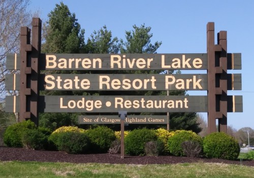 Sign for Barren River Lake State Resort Park, featuring Lodge and Restaurant, with trees in the background.