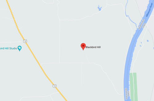 Map showing the location of Blackbird Hill, near a river and a studio, with surrounding roads and open space.