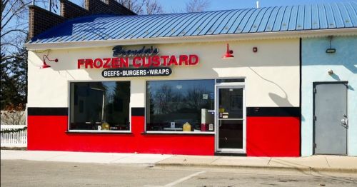 Exterior of a restaurant named "Brenda's Frozen Custard," featuring a colorful red and blue facade.