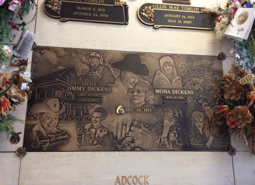 Bronze memorial plaque featuring portraits and names of Little Jimmy Dickens and Mona Dickens, with decorative elements.