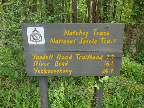Sign for Natchez Trace National Scenic Trail with distances to Yandell Road Trailhead, River Bend, and Yockanookany.