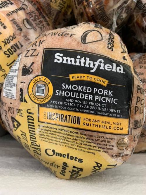 A packaged smoked pork shoulder picnic from Smithfield, labeled "Ready to Cook" with cooking instructions and ingredients.