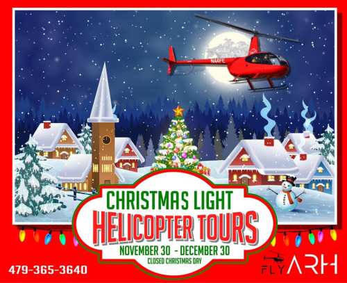 A festive scene featuring a helicopter flying over a snowy village with Christmas lights, a tree, and a snowman.