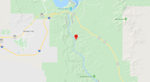 Map showing a location marked with a red pin near the Hoover Dam and surrounding mountainous terrain.