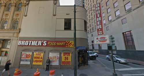 A corner store named "Brother's Food Mart" with a sign for fried chicken, open 24 hours, in an urban setting.