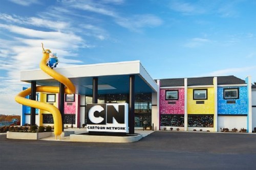 Cartoon Network building with a large slide, colorful exterior, and a prominent CN logo in front.
