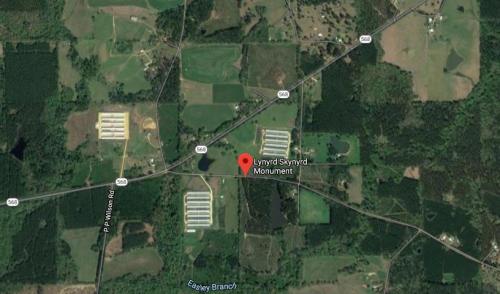 Aerial view of Lynyrd Skynyrd Monument location, surrounded by fields and roads in a rural area.
