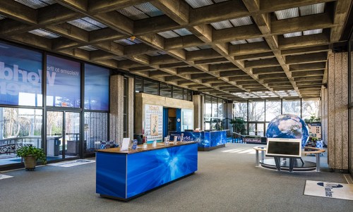Modern reception area with a globe display, large windows, and a welcoming atmosphere.