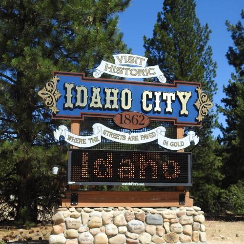 Sign for Idaho City, established in 1862, featuring the phrase "Where the streets are paved in gold."