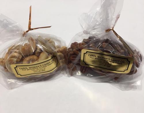 Two clear bags of candy from Carol Widman's Candy Co., one with pretzels and the other with assorted treats.