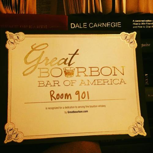 Sign for "Great Bourbon Bar of America, Room 901," dedicated to serving fine bourbon whiskey.
