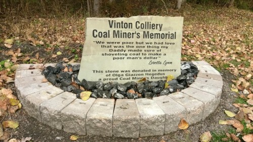 A memorial stone for Vinton Colliery Coal Miners, featuring a quote by Loretta Lynn and honoring Olga Giazton Hegedus.