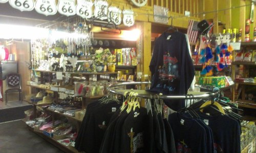 A colorful gift shop filled with souvenirs, T-shirts, and Route 66 memorabilia.
