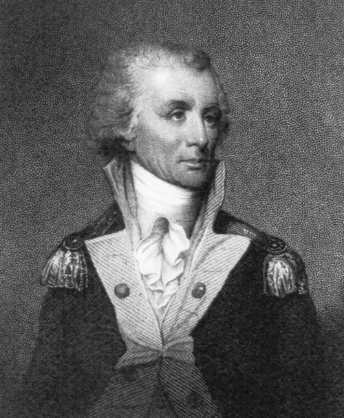 Portrait of a man in a military uniform with a high collar and epaulettes, featuring a thoughtful expression.