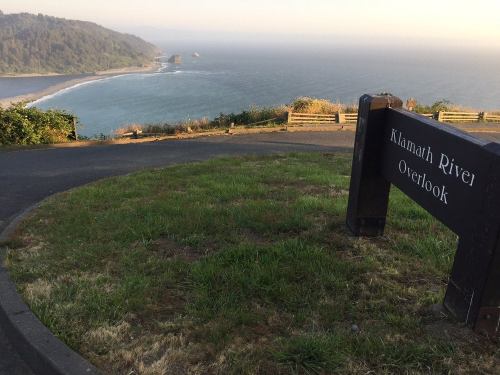 View of the Klamath River Overlook, showcasing a scenic coastal landscape with hills and ocean in the background.