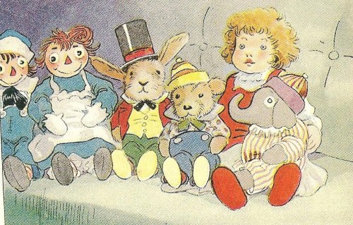 A group of colorful stuffed animals and dolls sitting together on a couch, featuring a rabbit, bear, and elephant.