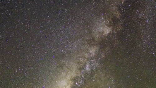 A stunning view of the Milky Way galaxy filled with stars and cosmic dust against a dark night sky.