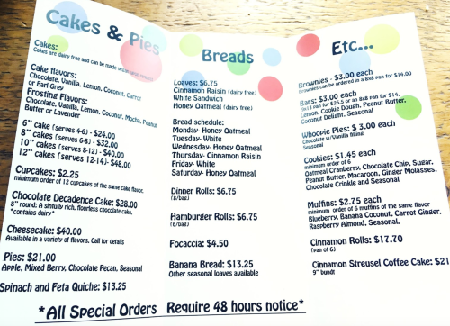 Menu featuring cakes, pies, breads, and desserts with prices listed for each item. Special orders require 48 hours' notice.