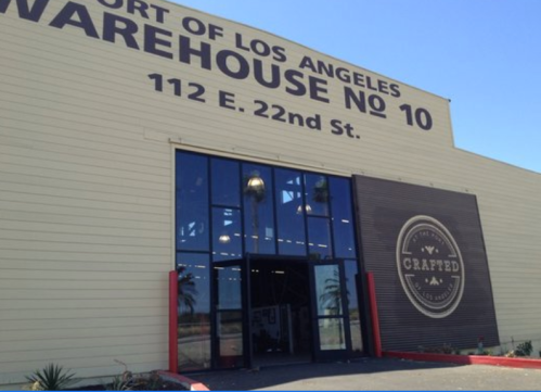 Exterior of Warehouse No. 10 at the Port of Los Angeles, featuring a large sign that reads "CRAFTED."