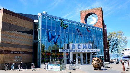 Exterior of the ECHO Leahy Center for Lake Champlain, featuring large butterfly decorations and a clock tower.