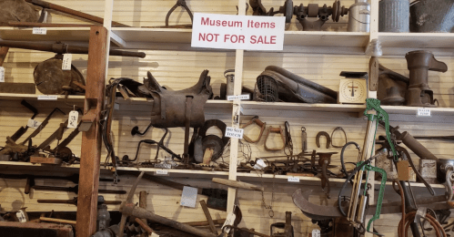 A display of various antique tools and equipment in a museum, labeled "Museum Items NOT FOR SALE."