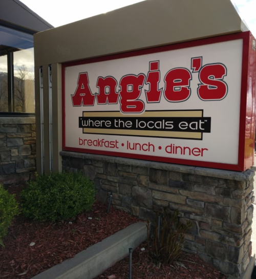 Sign for Angie's restaurant, stating "where the locals eat" with options for breakfast, lunch, and dinner.