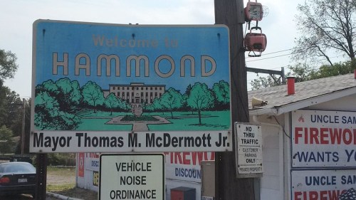 Welcome sign for Hammond, featuring Mayor Thomas M. McDermott Jr., with firework store advertisements below.