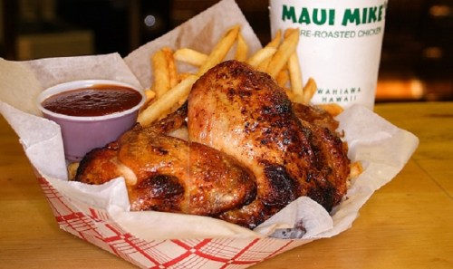 A basket of roasted chicken with fries and a side of barbecue sauce from Maui Mike's.