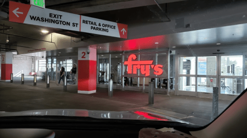 Entrance to Fry's grocery store with clear signage and parking area visible.