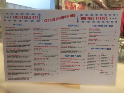 Menu featuring cocktails, boozy malts, slushies, and beer/cider floats with various drink options listed.
