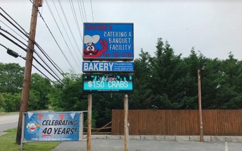 Sign for Salerno's Catering & Banquet Facility, featuring bakery info and a $1.50 crab special on Thursdays.