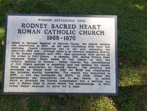 Historical marker for Rodney Sacred Heart Roman Catholic Church, detailing its history from 1868 to 1870.