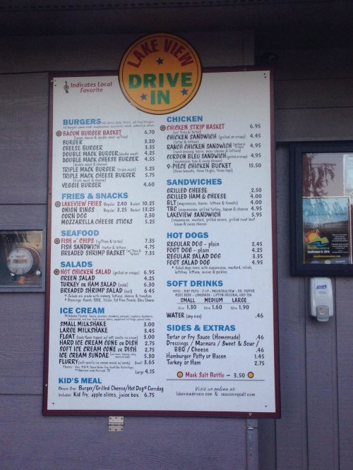 Menu board for Lake View Drive-In featuring burgers, chicken, fries, snacks, hot dogs, soft drinks, and ice cream options.