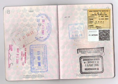 A passport page filled with various immigration stamps and visas from different countries and dates.