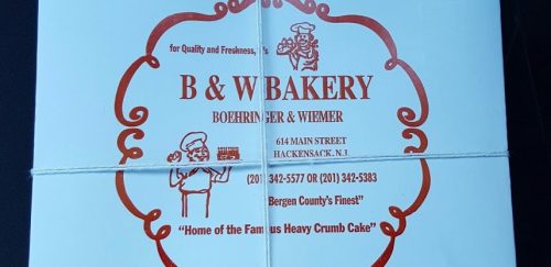 Light blue bakery box featuring "B & W Bakery" logo and contact information, highlighting their famous heavy crumb cake.