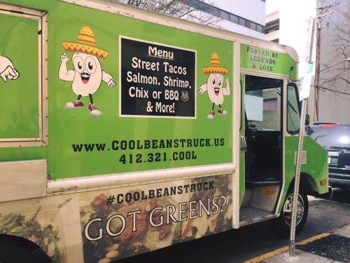 A colorful food truck with a menu featuring tacos, shrimp, and more, promoting "Cool Beans" and healthy eating.