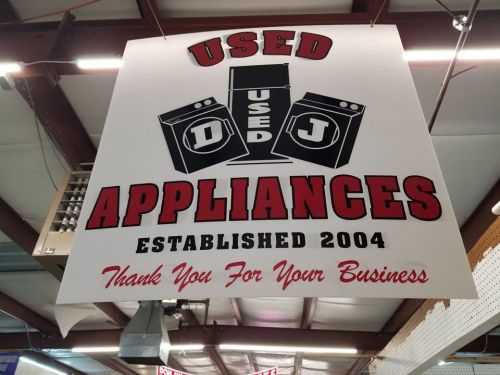 Sign for a used appliances store, established in 2004, thanking customers for their business.