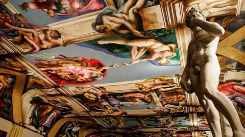 A detailed view of a ceiling mural featuring classical figures and a statue, showcasing vibrant colors and intricate designs.