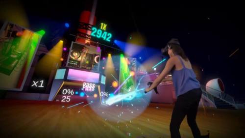 A person in a VR headset dances with a glowing controller in a colorful, vibrant virtual environment.