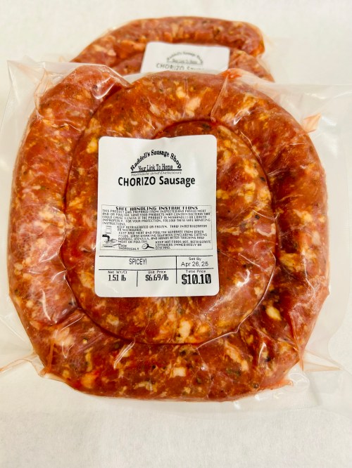 Two packages of chorizo sausage, labeled with price and weight, displayed on a white background.