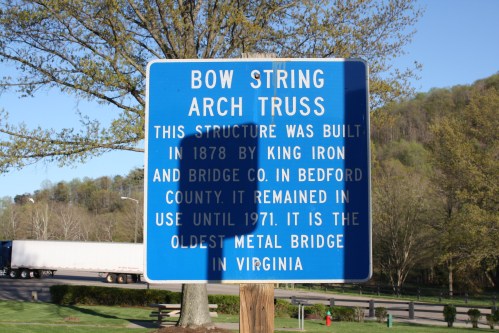 Sign detailing the Bow String Arch Truss bridge, built in 1878, the oldest metal bridge in Virginia.
