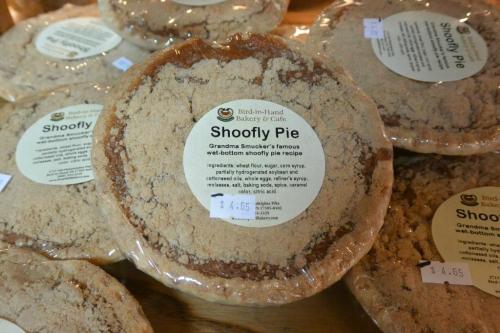 A display of Shoofly Pie, labeled with ingredients and price, at Bird-in-Hand Bakery & Café.