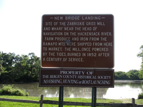 Sign about New Bridge Landing, detailing the history of the Zabriskie Grist Mill and its significance near the Hackensack River.
